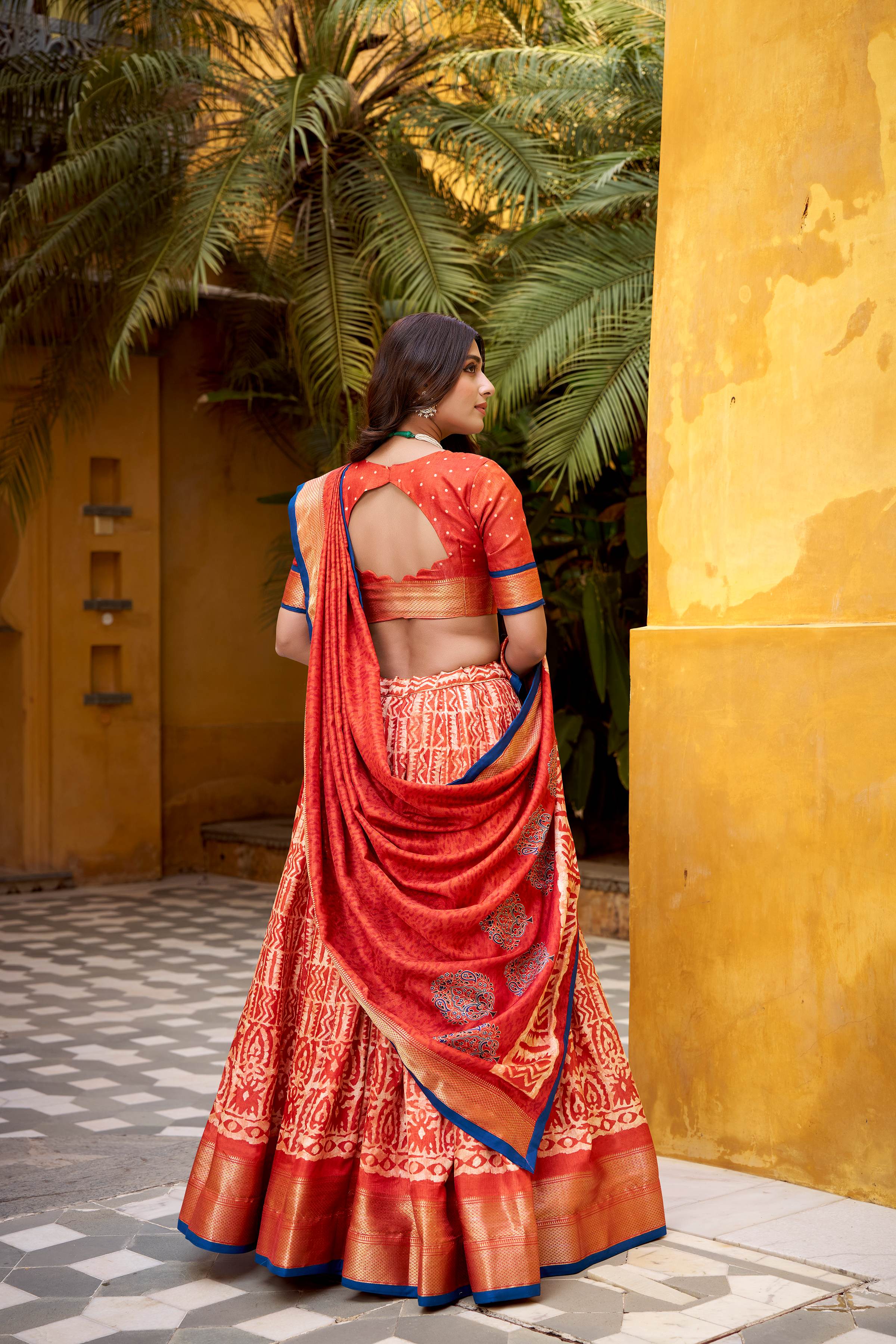 Dola Silk Lehenga Choli featuring traditional batik art