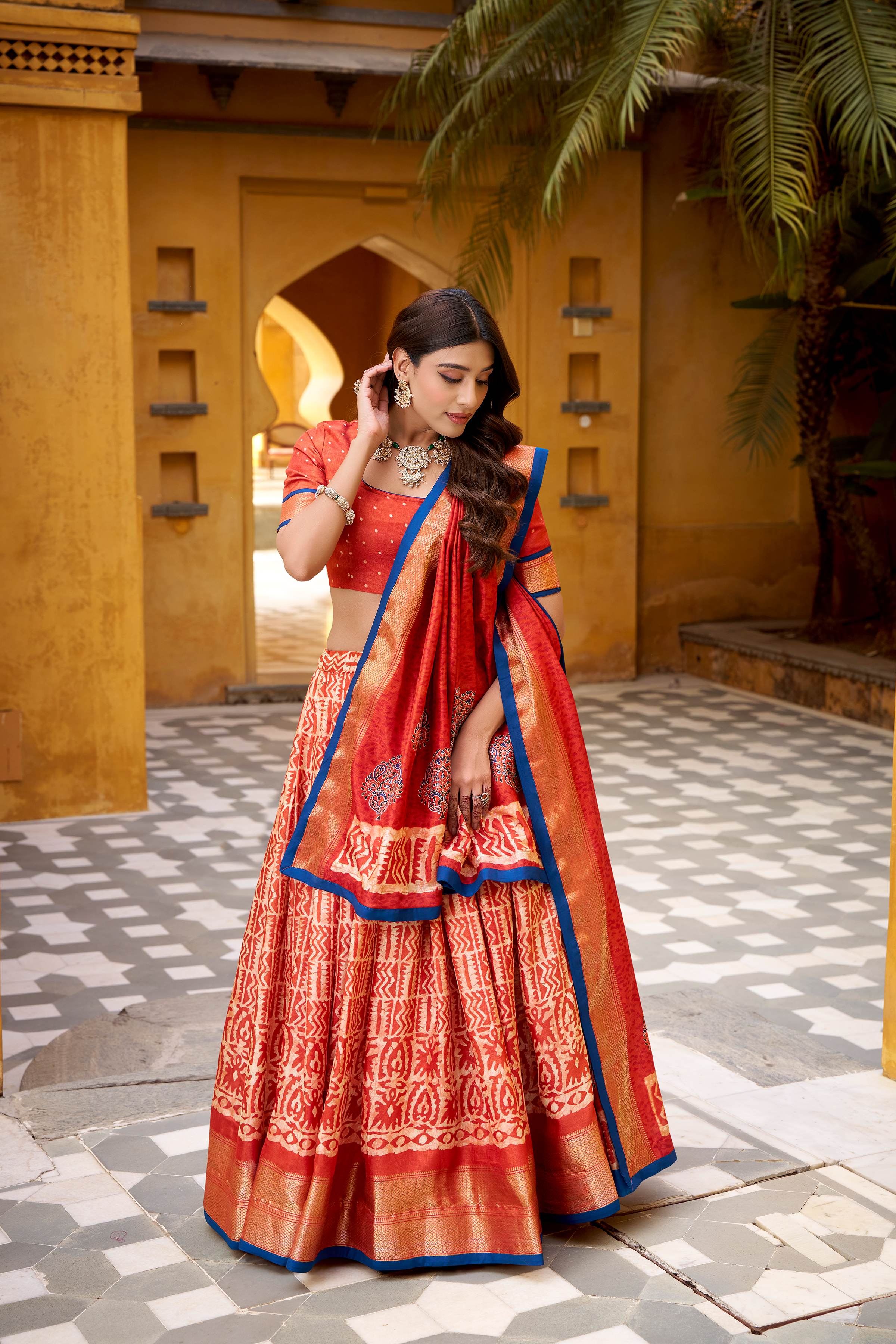 Dola Silk Lehenga Choli featuring traditional batik art