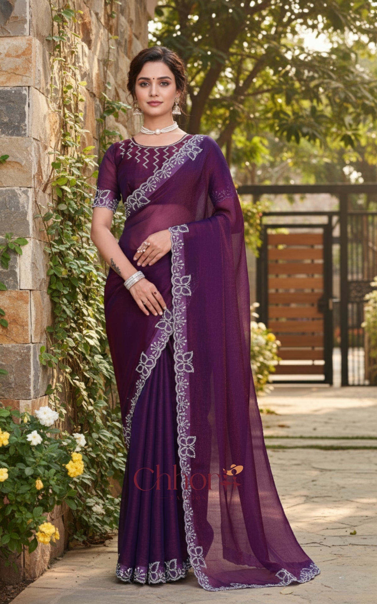 Woman wearing a purple saree with white embroidery in an outdoor setting. | Chhorii Fashion