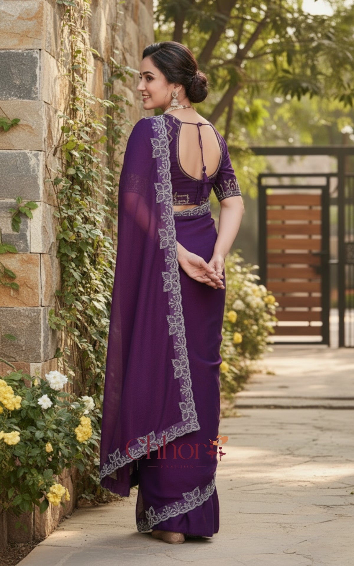 Woman in a purple saree with a floral background | Chhorii Fashion